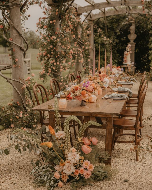 Summer wedding inspiration at Euridge Manor with orange, coral and peach wedding flowers and decor, and with Made With Love dresses