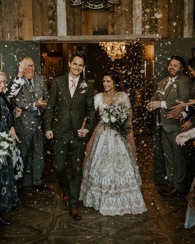 Wharfedale Grange wedding for multicultural couple as they exit to confetti