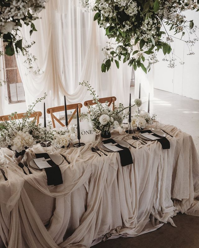 Black and white table setting for wedding at Willow Grange Farm.
