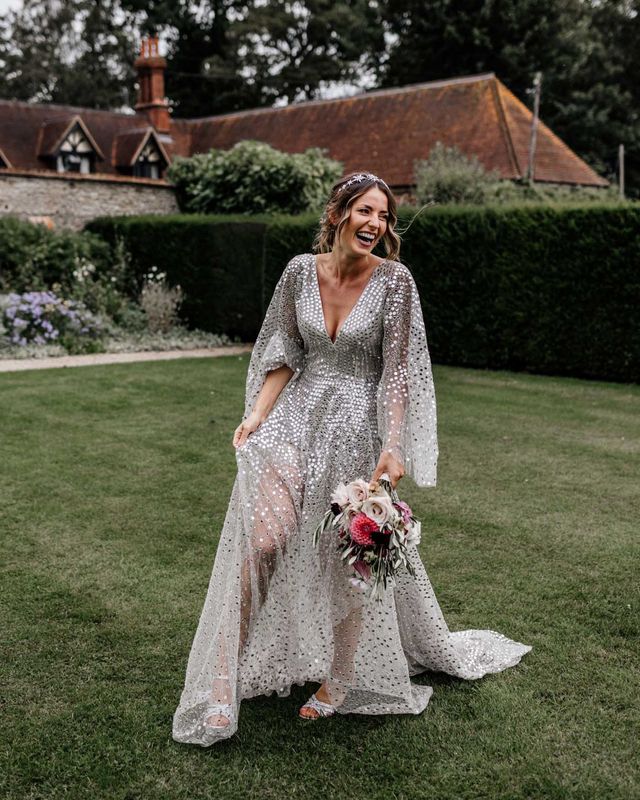 Silver sequin wedding dress, and gypsophila flower clouds for a marquee reception at home