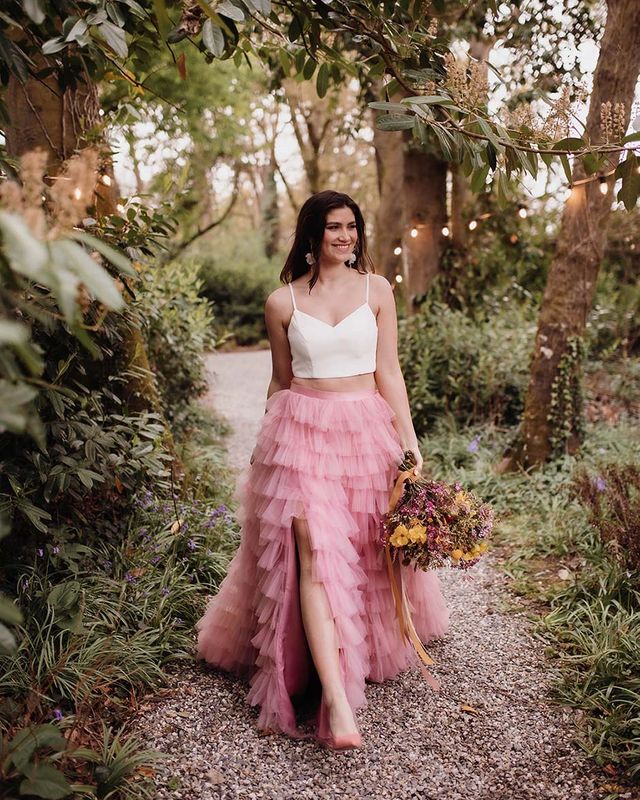 Spring wedding inspiration with colourful flowers and a pink ruffled wedding skirt and short wedding dress by Kyrstin Healy Photography