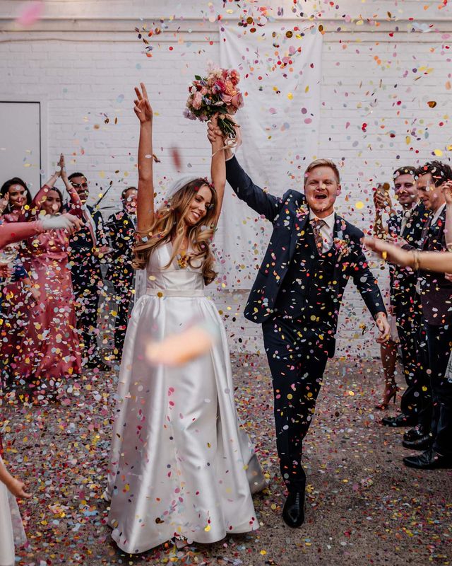 Stylish London wedding at The Loft Studios planned in 4 months with a gospel flash mob choir, 1KG of confetti and pink bridesmaid dresses.