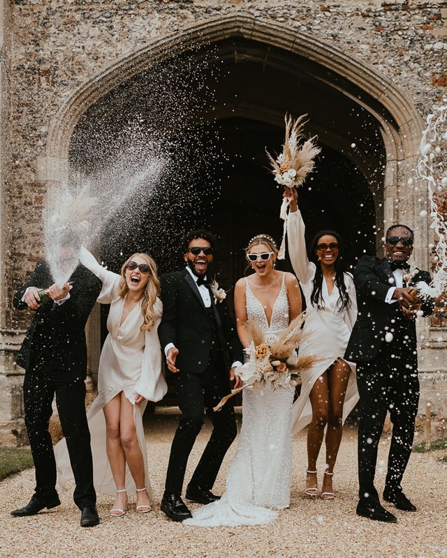 Modern luxury wedding with black tie fashion, dried and fresh flowers and a vintage car