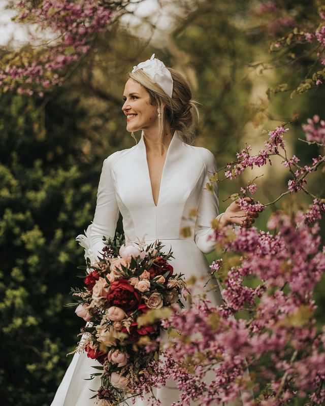 Bride in traditional wedding dress for classic Stowe House wedding.