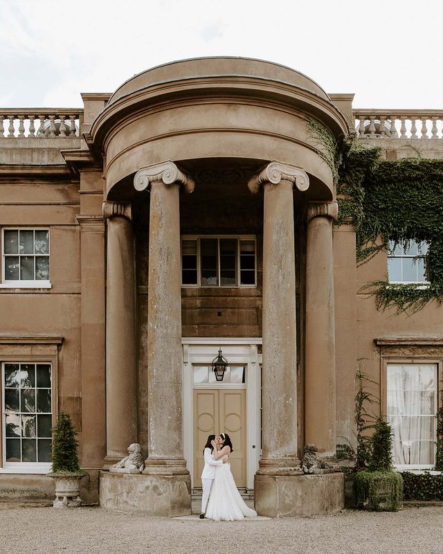 Brides share a kiss at their wilderness reserve wedding