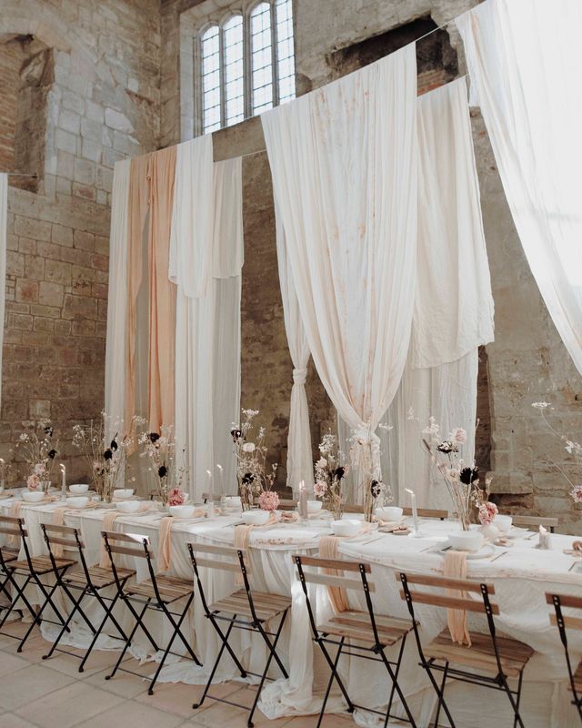 Blackfriars Priory gothic wedding inspiration with drapes, dried flowers and a concrete wedding cake.