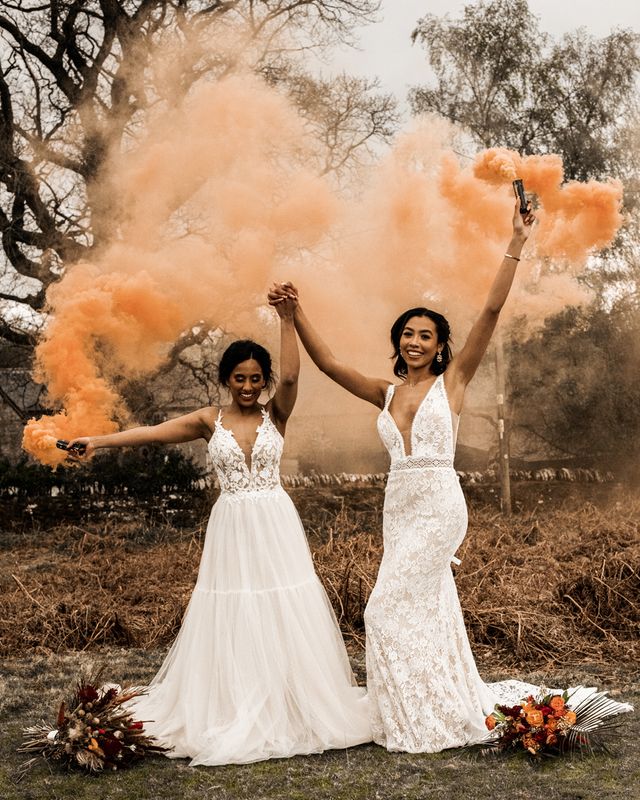 Farm Wedding venue inspiration with alpacas, gold Moroccan decor and two brides in lace dresses