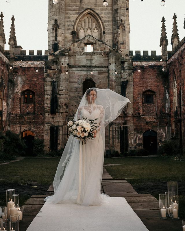 Wedding Inspiration at St Luke's Bombed Out Church in Liverpool with white flowers, festoon lights and drapes.