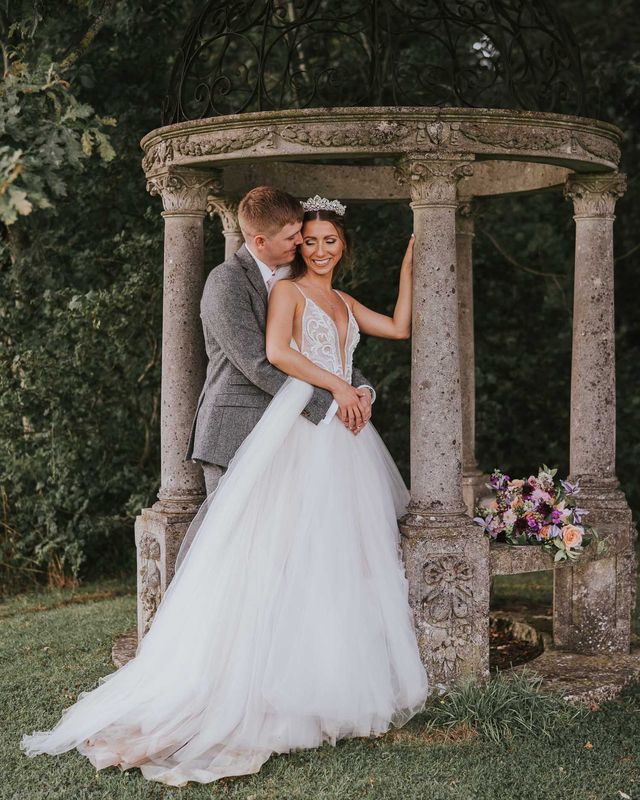Rustic summer wedding complete with a fun hydration station and a pink and grey colour scheme.