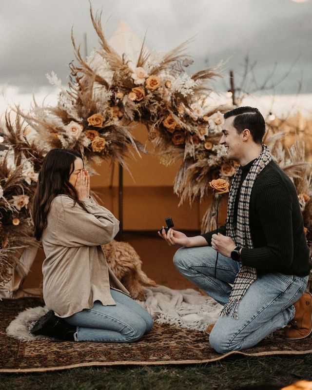 man-proposes-to-woman-in-boho-bell-tent