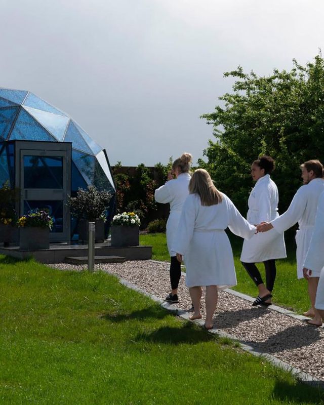 guests walking to mindfulness dome at glass house wellness retreat in essex