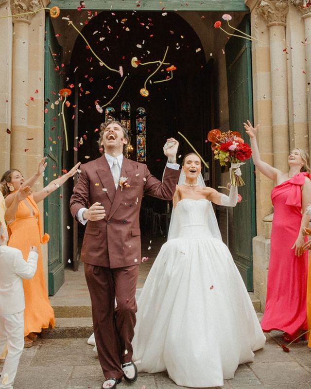 Couple's ceremony exit with real flower biodegradable confetti and stems