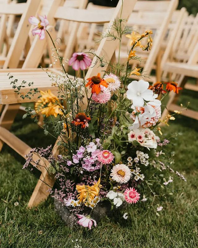 spring wedding flowers meadow aisle arrangement