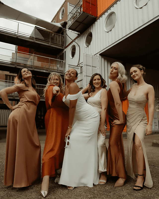 mismatched orange and neutral bridesmaid dresses for wedding colour palette 