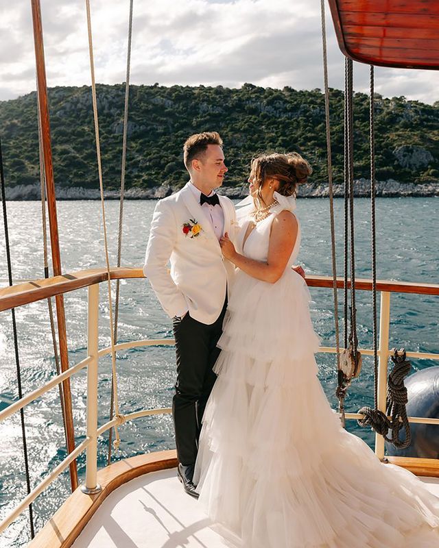 Bride and groom posing for picture at boat wedding in Split