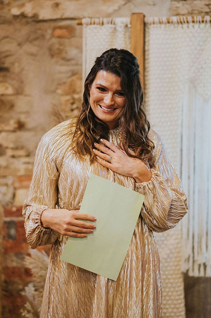 Maid of honour in long sleeve high neck golden dress