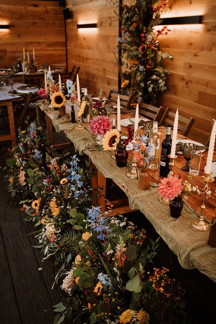 Seasonal wedding flower table arrangements with sunflowers, dahlias and more 