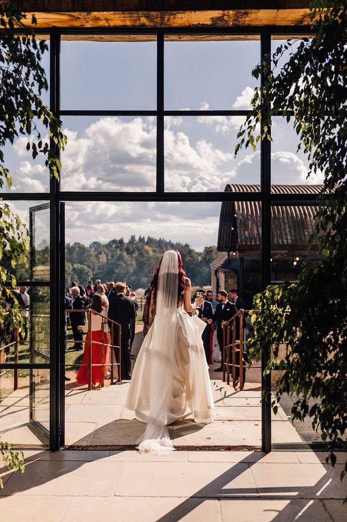 Bride exits the barn at Old Gore Barn Yard Space 