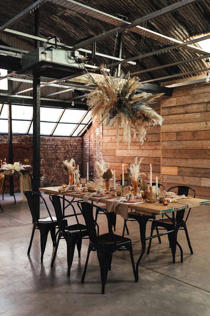 Classic rustic wedding tablescape with pampas grass wedding centrepieces and suspended pampas grass wedding decor at The Shack Revolution wedding venue