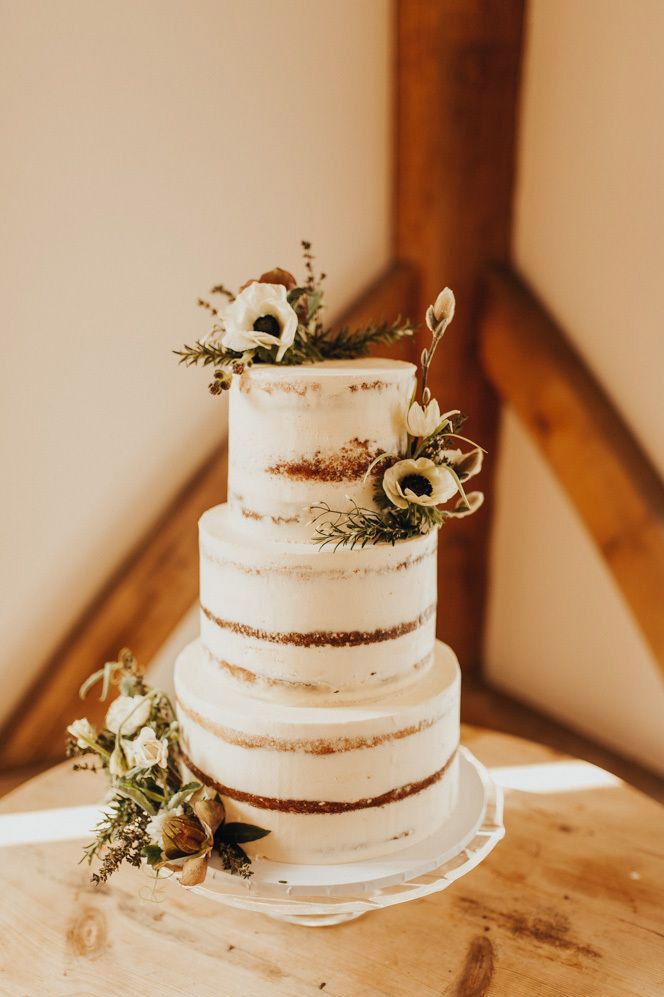 White semi-naked wedding cake at Nancarrow Farm wedding