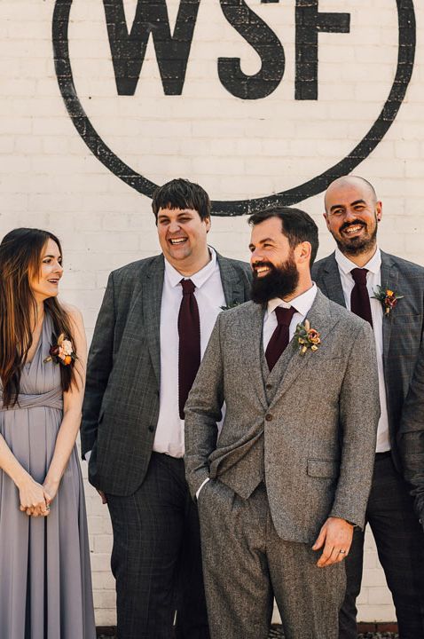 Mixed gender wedding party with groomswoman all wearing grey for the industrial style wedding at White Skye Fields