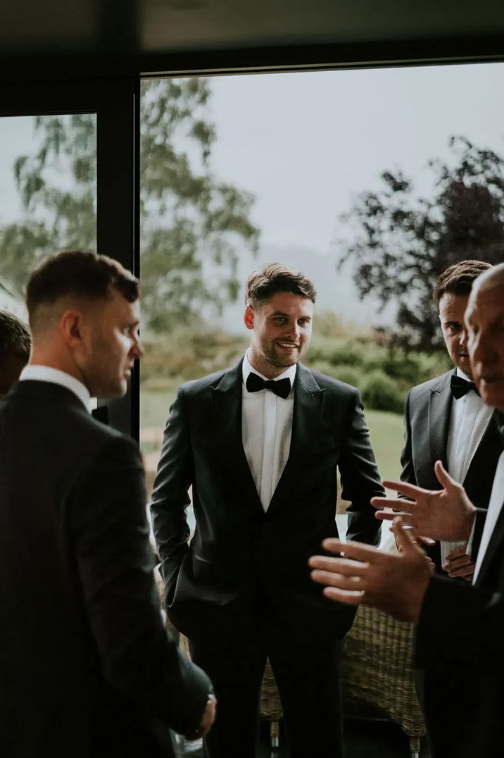 Groomsmen in tuxedos hotsell