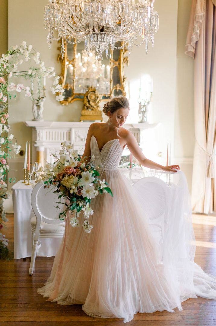 Strapless tulle blush pink princess wedding dress by Jo Bradbury Photography