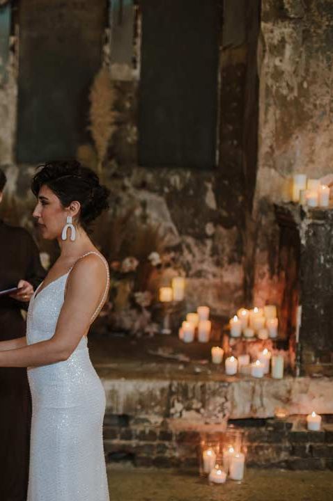 Bride in off the shoulder satin wedding dress and bride in sleeveless sparkly wedding dress getting married at Asylum London wedding - other section of wedding budget spreadsheet 