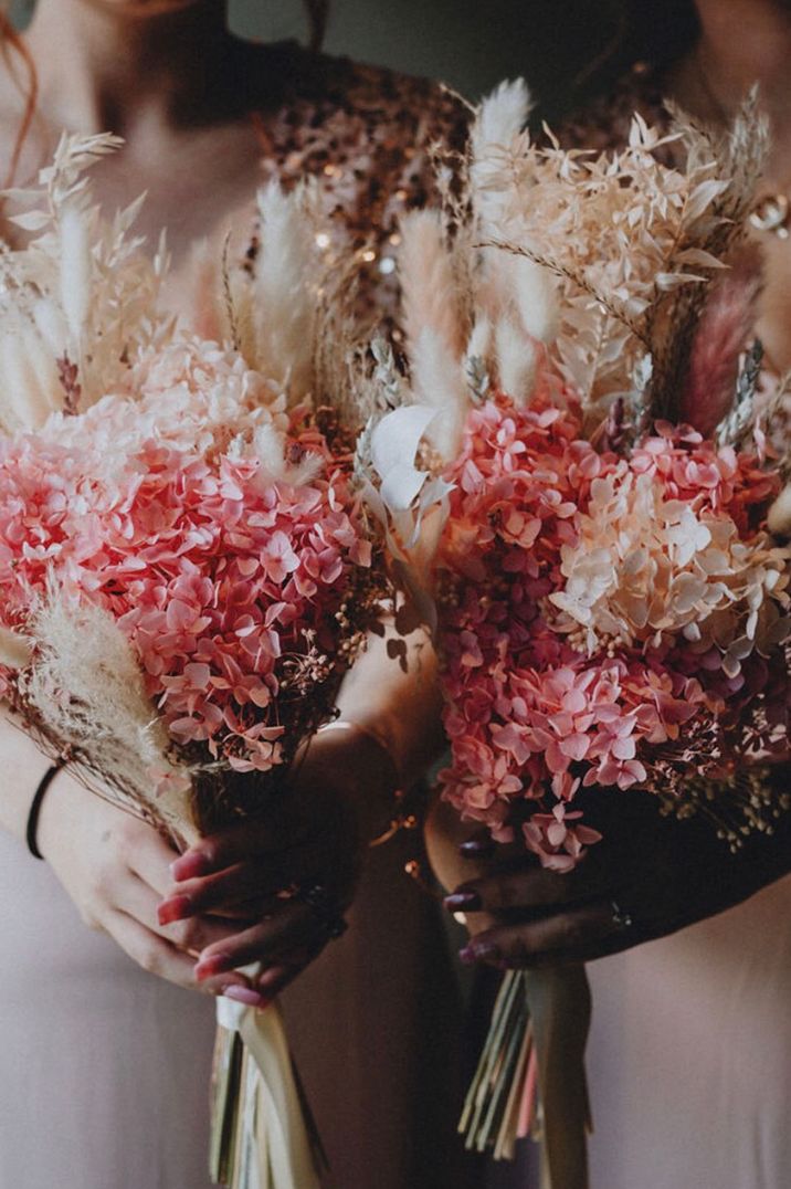 Wedding flower bouquets with pink and white hydrangeas with dried fluffy grass 