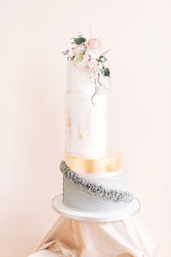 4 tier architectural wedding cake in pastel colours