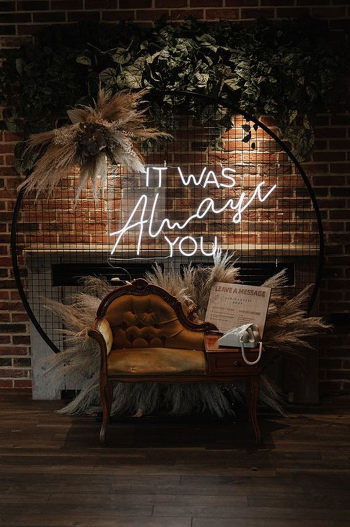 neon wedding sign, chair and rotary telephone audio guest book