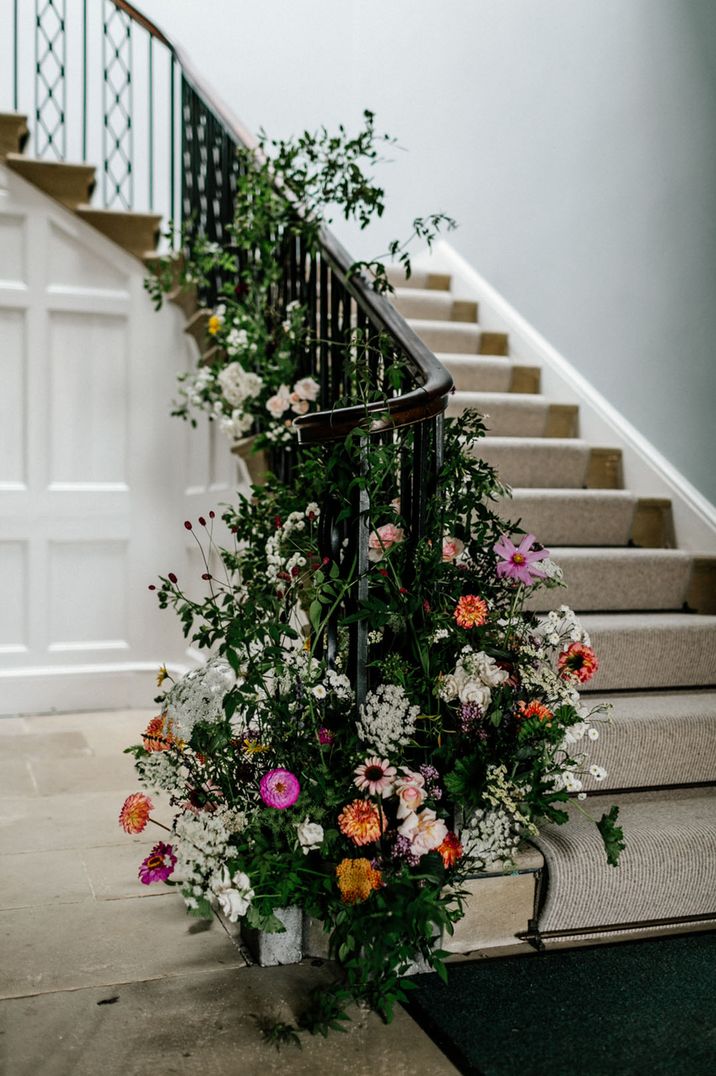 Colourful wedding staircase flower arrangements inspired by birth flowers by month with meanings 