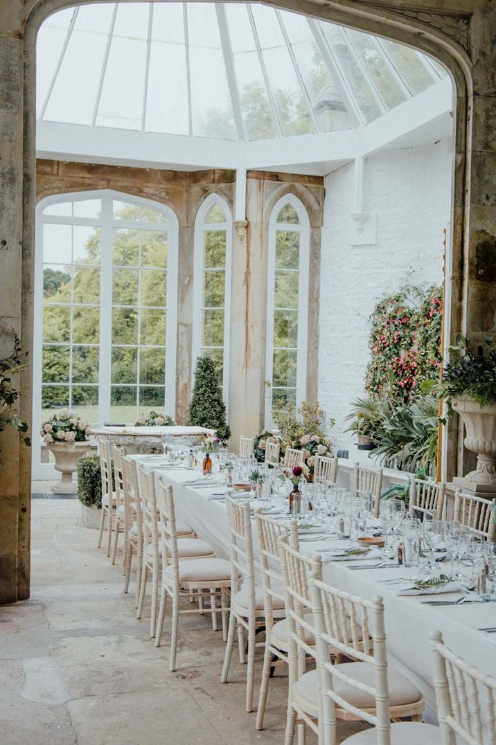 Crisp white wedding tablescape at Crom Castle glasshouse wedding venue in Northern Ireland 