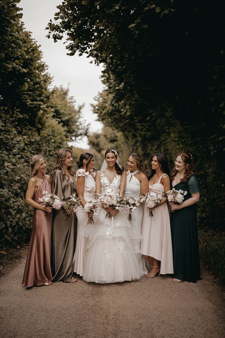 Weddings over 60k roundup with Harley and Louis' wedding at Anran with the bridesmaids in mismatched bridesmaid dresses 