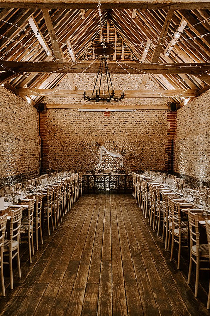 Cissbury Barns rustic wedding venue decorated with fairy lights and boho pampas grass 