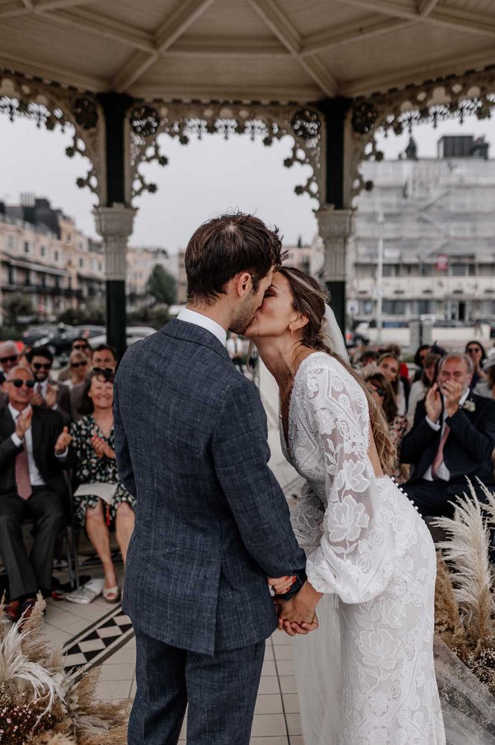 Brighton Bandstand wedding with dried grasses and lace wedding dress