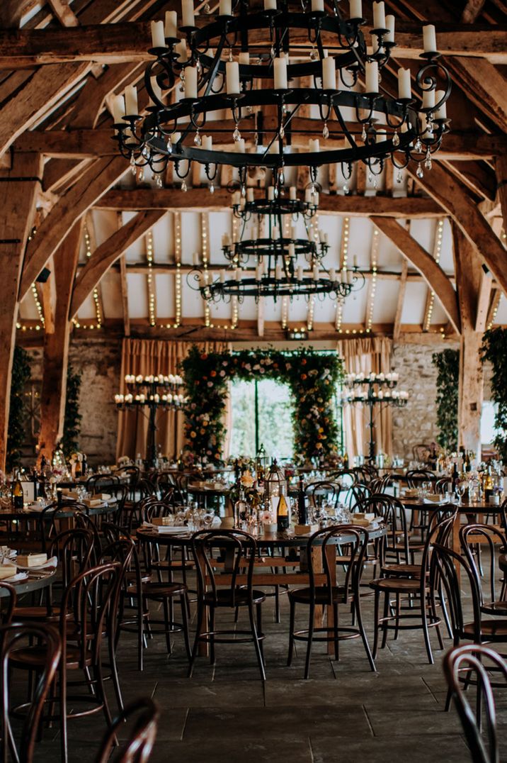 Rustic Tithe Barn wedding venue decorated for the multicultural same sex wedding under 40k 