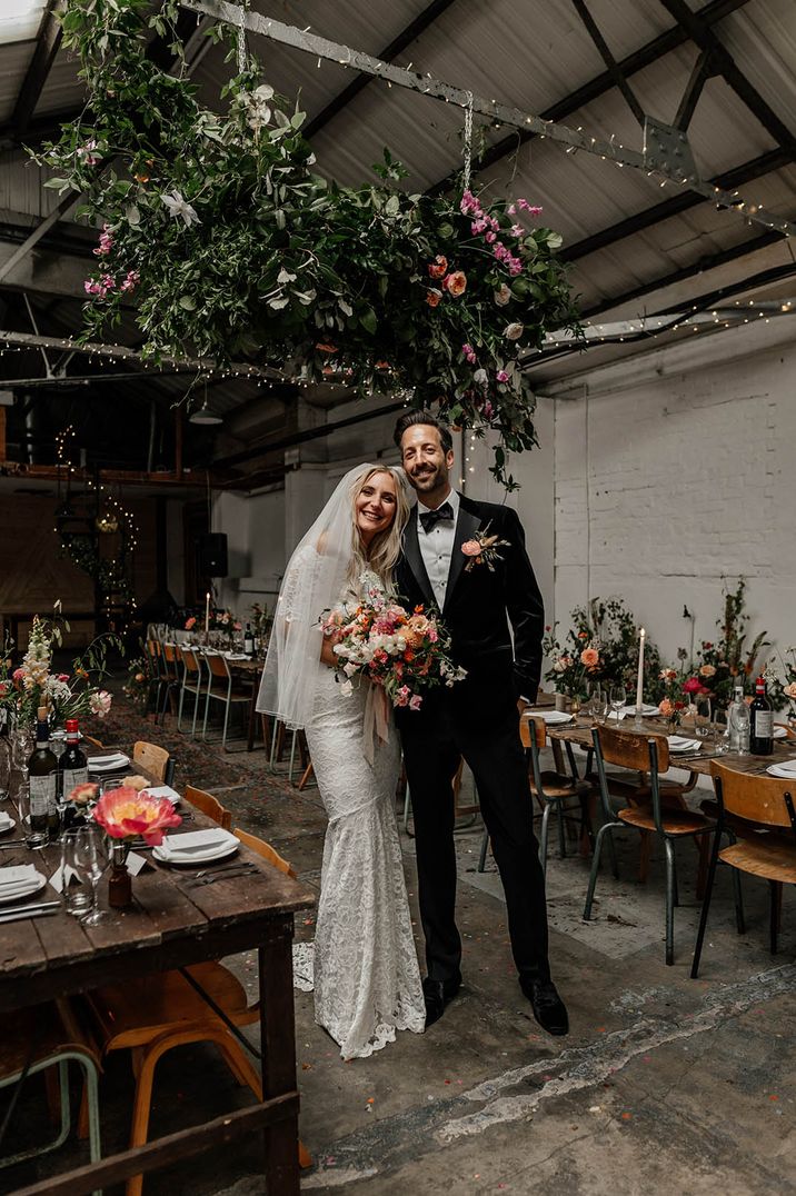 Hackney Studios wedding with the groom in black tie with the bride in two piece boho lace bridal separates 