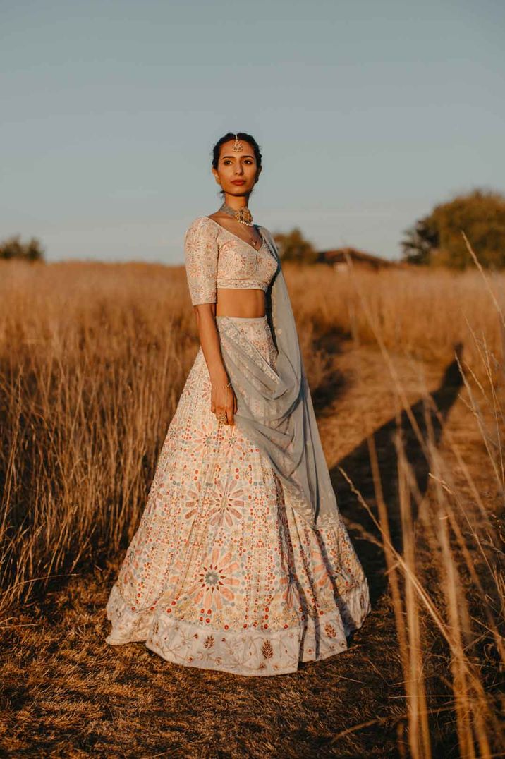 Bride in Indian two piece bridal set at High Billinghurst Farm wedding 