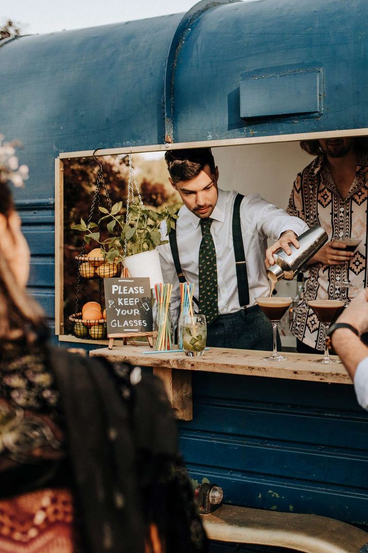 DIY drinks bar in old van at garden wedding reception