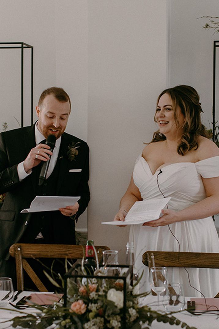 Aswarby Rectory wedding with the bride and groom standing up at their wedding reception for their joint wedding speech 