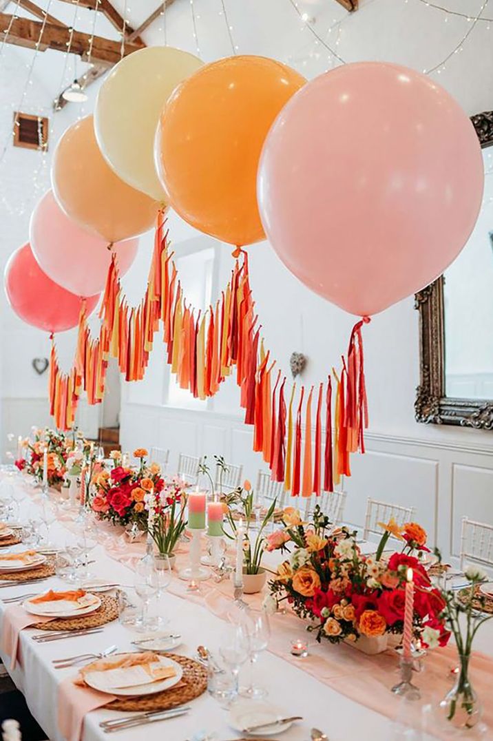 pink and orange table decor with balloons by Sarah J Scott Photography