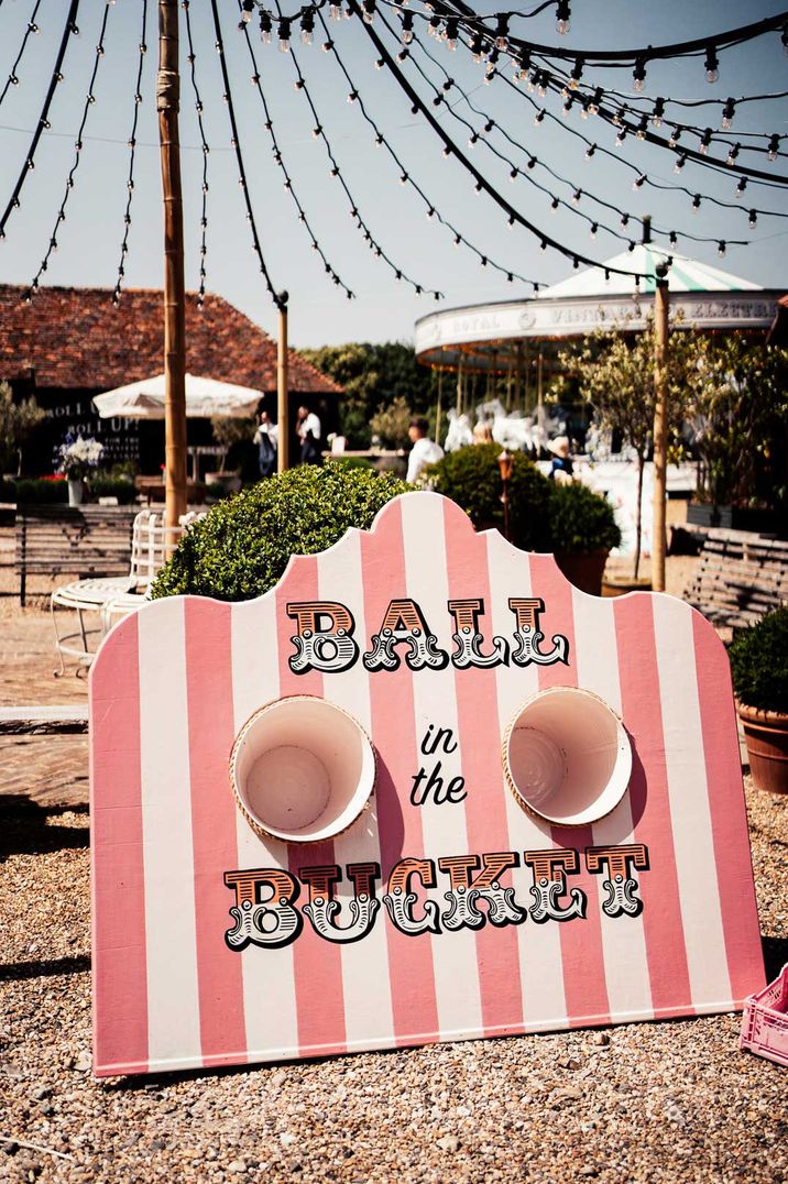 Large outdoor wedding game - pink and white ball in the bucket wedding game at Preston Court 