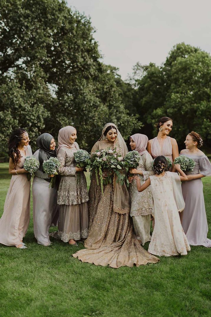 Bridal party standing around bride at Nikah wedding ceremony - hen party ideas