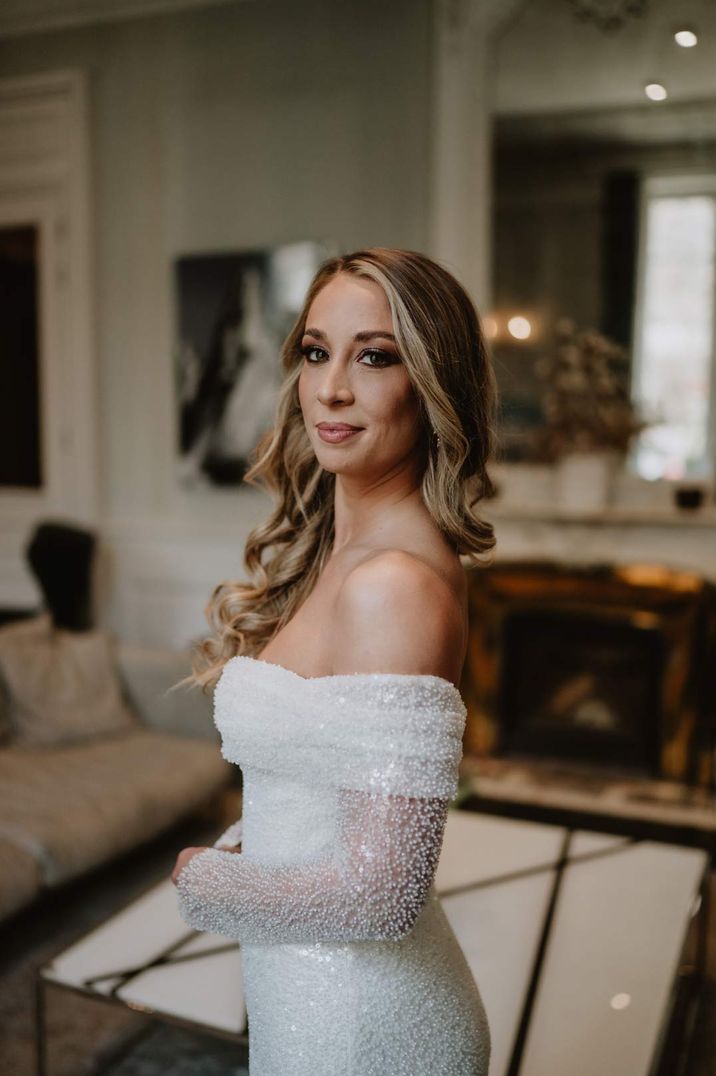 bride with natural wedding makeup in an off the shoulder Eva Lendel sparkly wedding dress