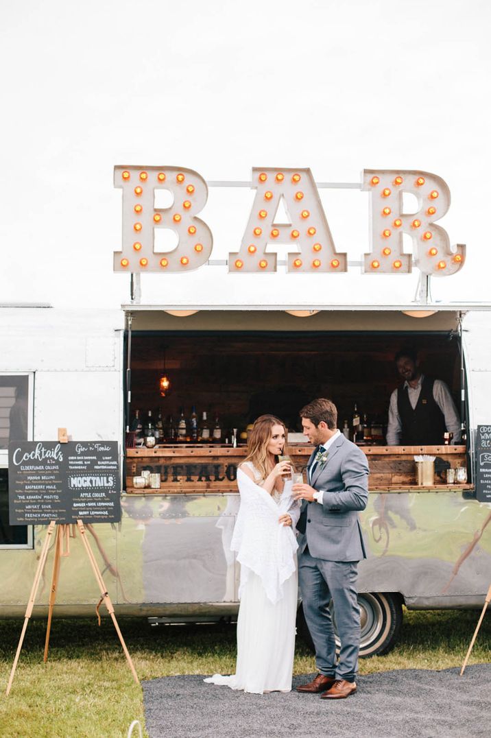 Wedding bar design ideas with large light up bar sign and chalk board menu signs