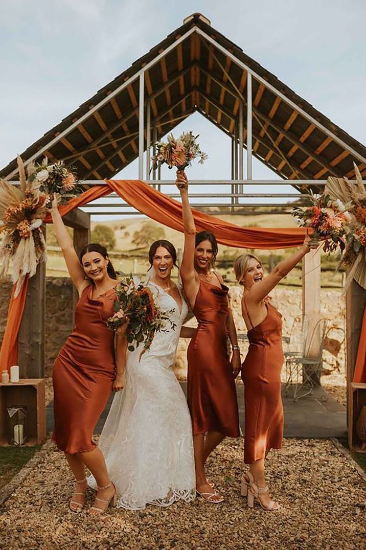  burnt-orange-bridesmaid-dresses-Laura-Dean-Photography