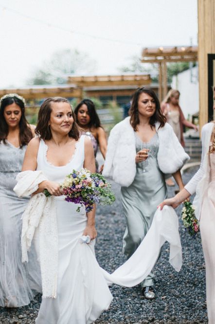 Bride, best woman and bridal party walking