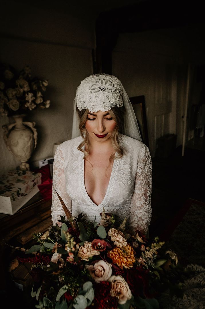 Bride wears lace Juliet cap veil 