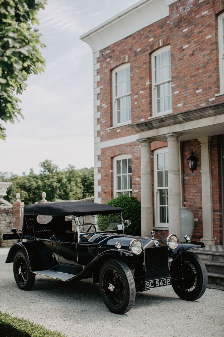 Black vintage wedding car transportation for 60k wedding 